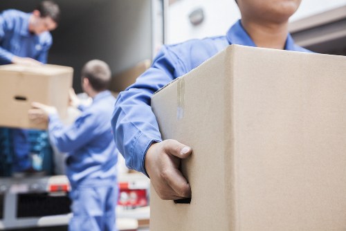 Professional team preparing furniture for pick-up in Merton Storage
