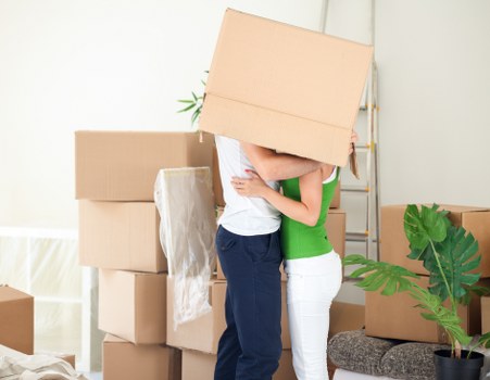 Moving furniture and boxes into storage with care