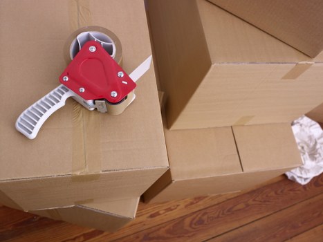 Professional movers loading a van